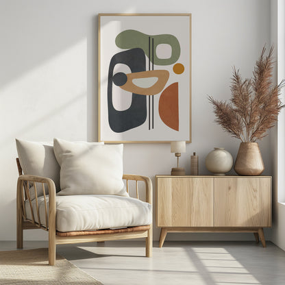 A framed abstract art piece featuring a collection of overlapping organic shapes in muted earth tones of sage green, dark grey, ochre, and terracotta. The shapes, some with cutouts, are arranged vertically against a light cream background, with three thin black vertical lines dissecting the composition. Poster