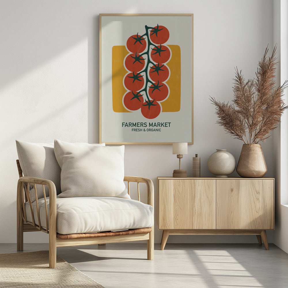A vintage-style art print of bright red cherry tomatoes on a dark green vine, set against a mustard yellow rectangle on an off-white background. Below the image, text reads 'FARMERS MARKET' and 'FRESH & ORGANIC'. Decor