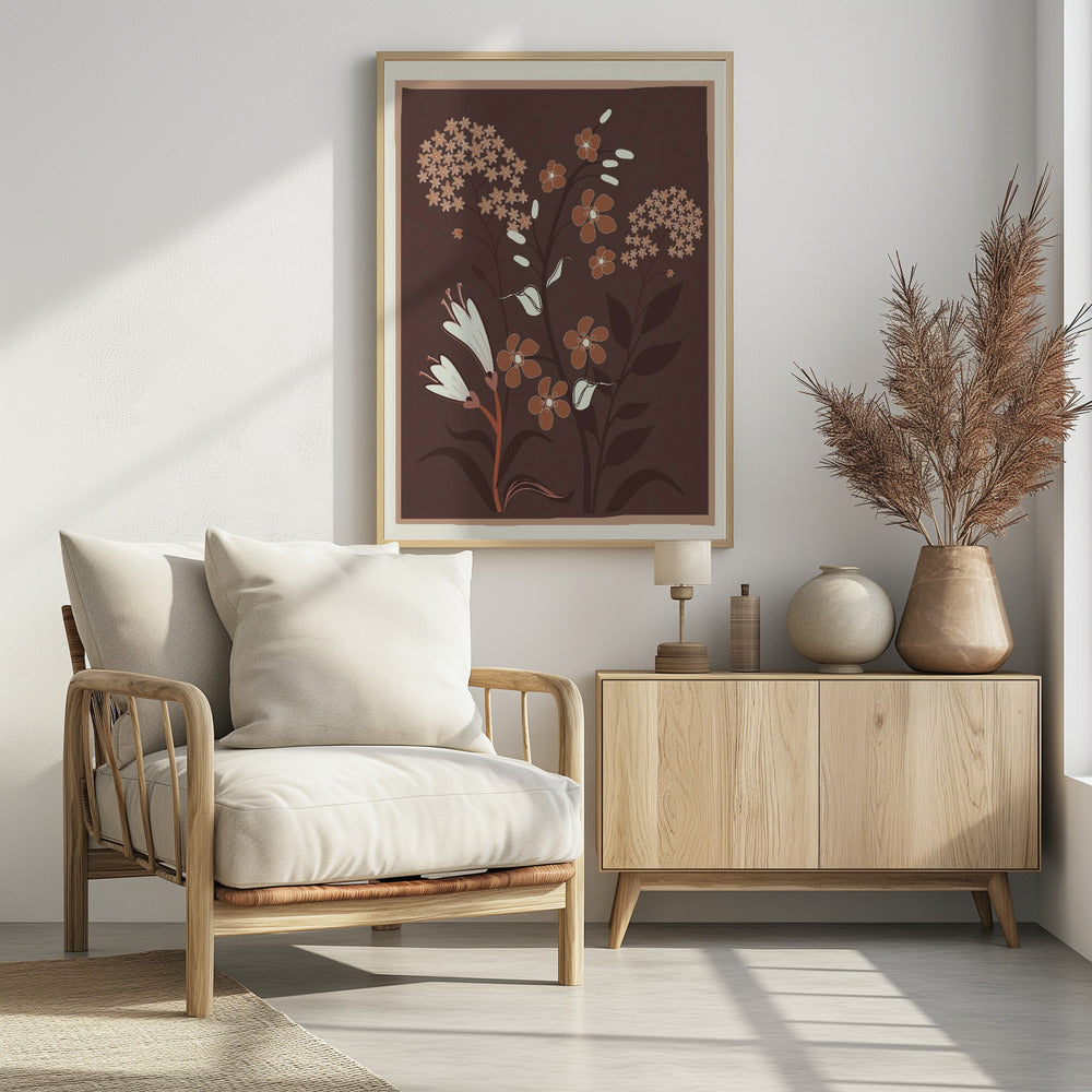 A modern botanical illustration featuring stylized flowers in shades of rust, cream, and light brown against a deep brown background. The framed artwork showcases a variety of floral shapes, including trumpet flowers and small clustered blossoms, in a simple, elegant composition. Artwork