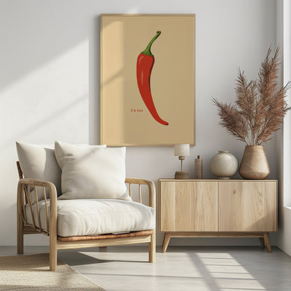 A minimalist poster in a black frame featuring a single, vibrant red chili pepper with a green stem against a cream background. Below the pepper, the text 'I'm hot' is printed in a simple font. Print