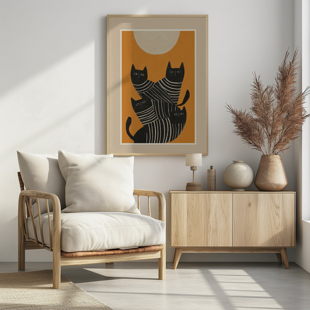 A framed art print of a stylized illustration featuring four black cats with white striped bodies stacked together. They are set against a solid orange background with a large, textured, cream-colored moon or sun at the top. Artwork