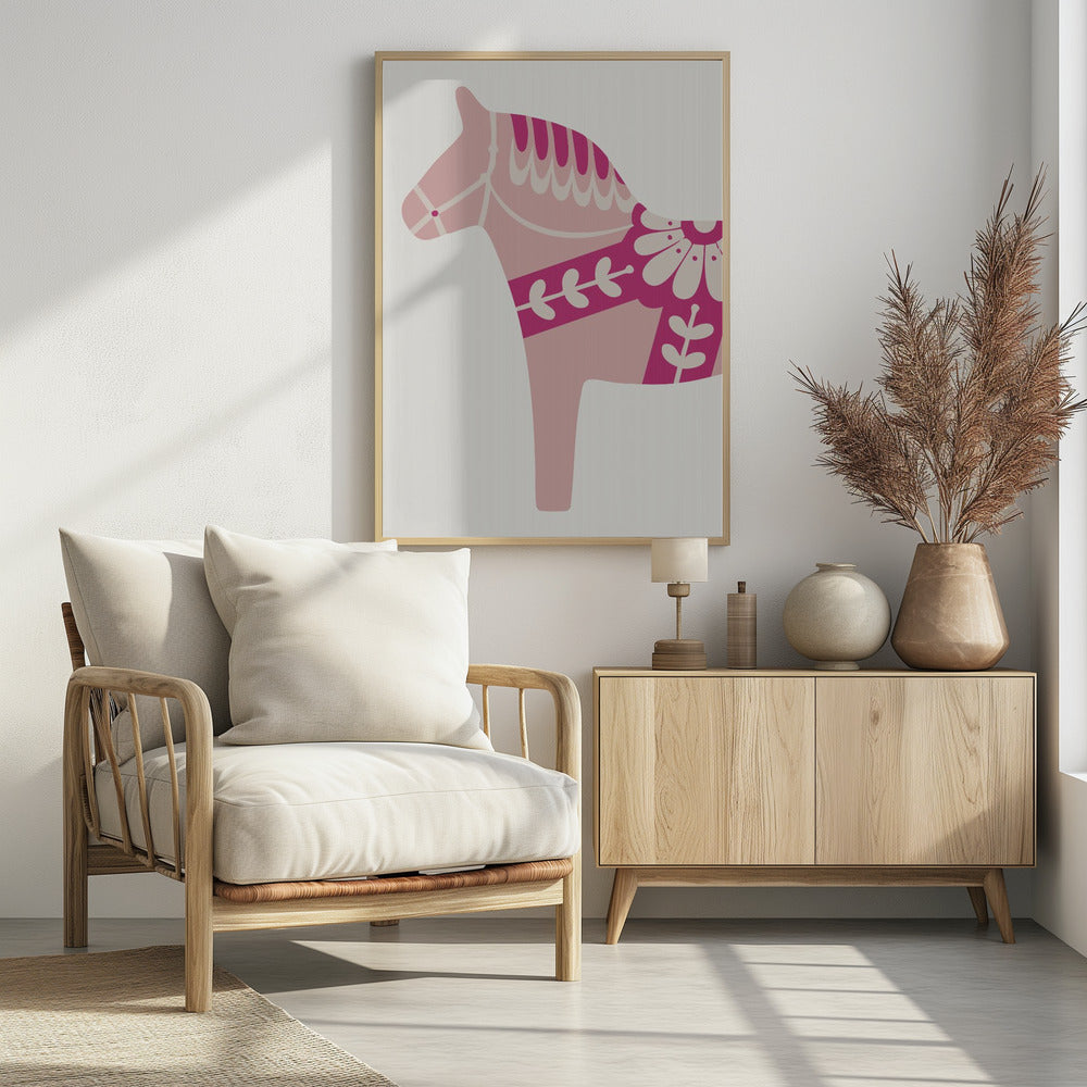 A framed art print featuring a stylized Scandinavian Dala horse in profile. The horse is various shades of pink and magenta with decorative off-white patterns on its mane, bridle, and saddle area, set against a light gray background. Decor