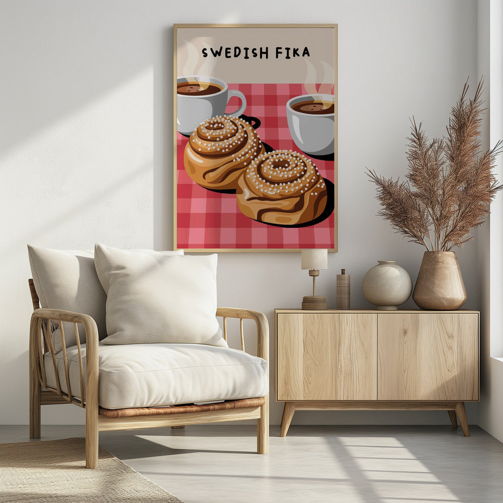 An illustration of a Swedish Fika poster featuring two large cinnamon buns topped with pearl sugar and two white cups of steaming hot coffee on a red and pink checkered tablecloth. The words 'SWEDISH FIKA' are written at the top. Artwork