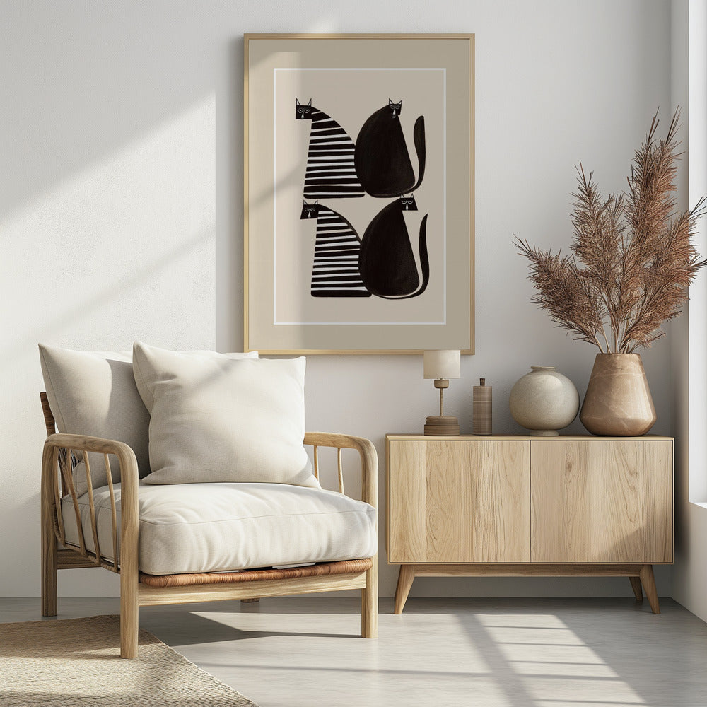 A modern graphic art print of four stylized cats against a light beige background, enclosed in a white and beige mat and a black frame. The cats are arranged in two pairs; each pair consists of one solid black, rounded cat and one cat with a triangular body featuring black and white horizontal stripes. Decor
