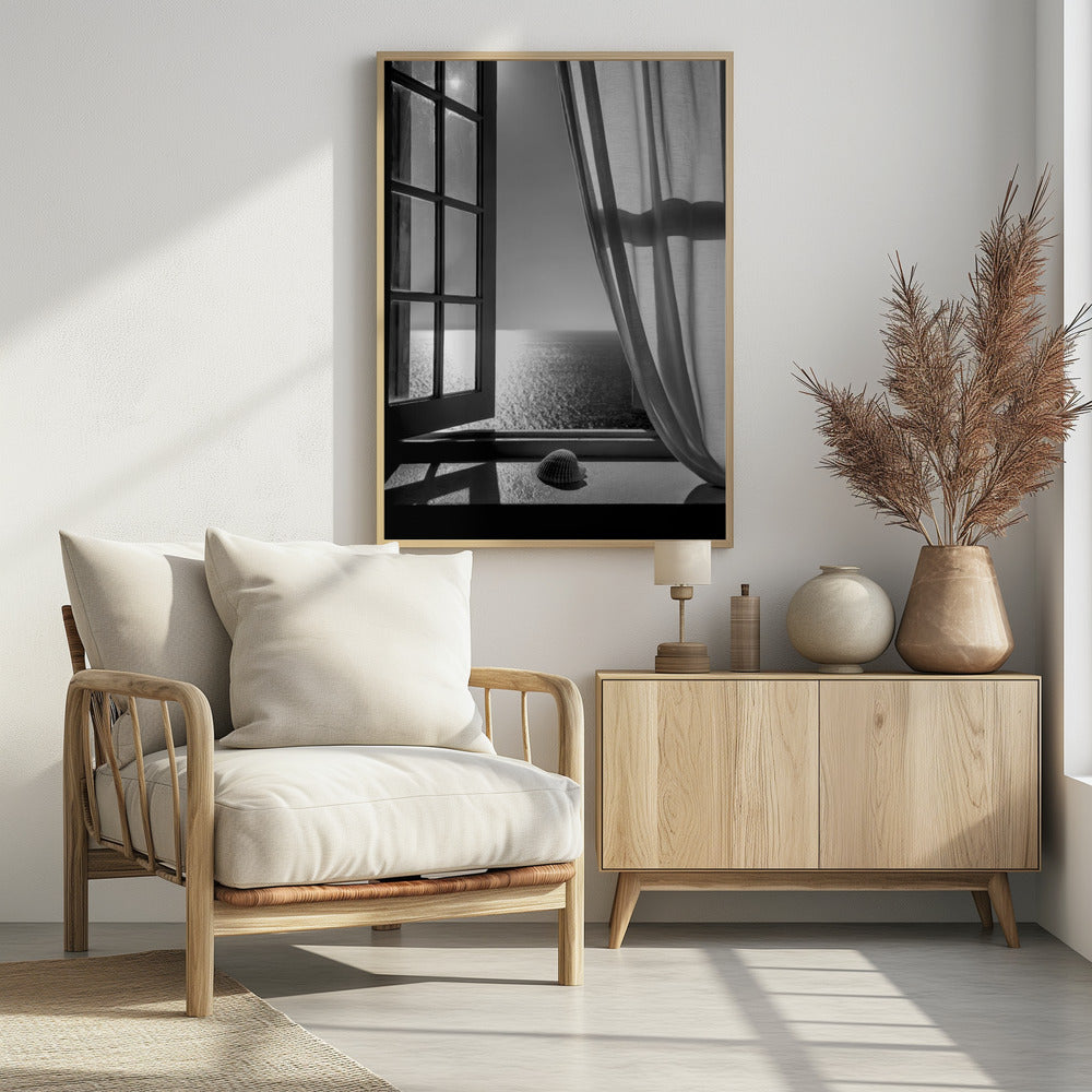 A serene black and white photograph looking out an open paned window at a sunlit ocean. A single seashell rests on the windowsill in the foreground, with shadows cast by the window frame. A light curtain hangs to the right, framing the tranquil sea view. Poster