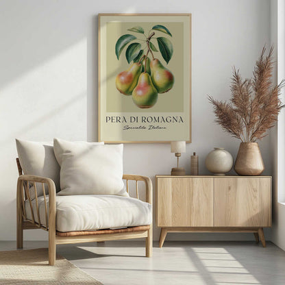 A vintage botanical art print of four 'Pera di Romagna' pears hanging from a leafy branch against a pale greenish-yellow background. Below the fruit, the text reads 'PERA DI ROMAGNA' and 'Specialita Italiane'. The print is displayed in a black frame. Decor