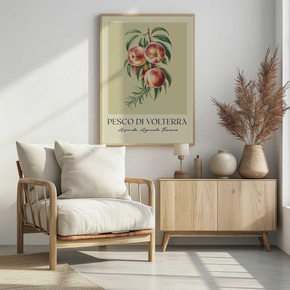 A vintage-style botanical poster of a peach branch with several ripe, red and yellow peaches and green leaves, set against a muted beige background. The poster has Italian text at the bottom that reads 'PESCO DI VOLTERRA' and 'Azienda Agricola Toscana' and is shown in a black frame. Decor