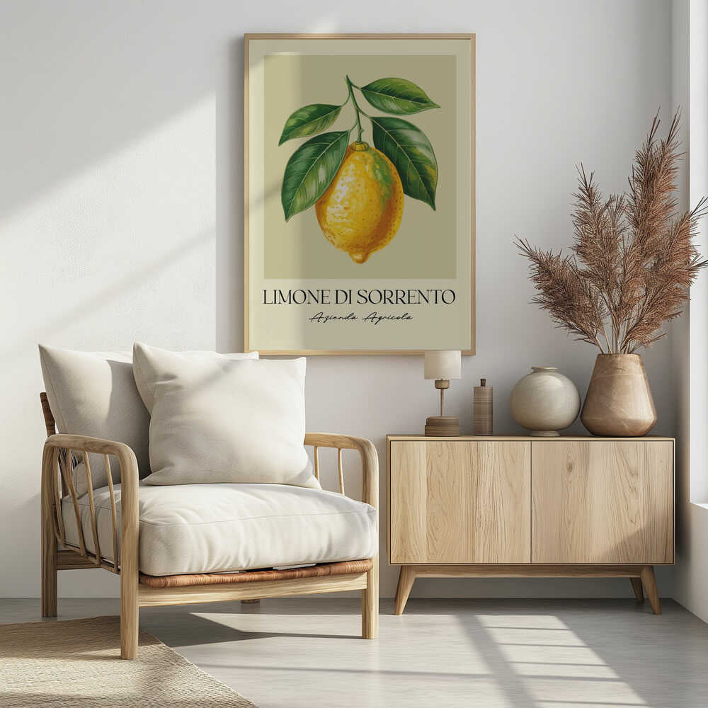 A vintage-style art print featuring a detailed illustration of a large yellow Sorrento lemon hanging from a branch with several green leaves. The background is a solid cream color. Below the image, the text 'LIMONE DI SORRENTO' is printed in a black serif font, with 'Azienda Agricola' underneath in a script font. The entire print is framed in a simple black frame. Poster