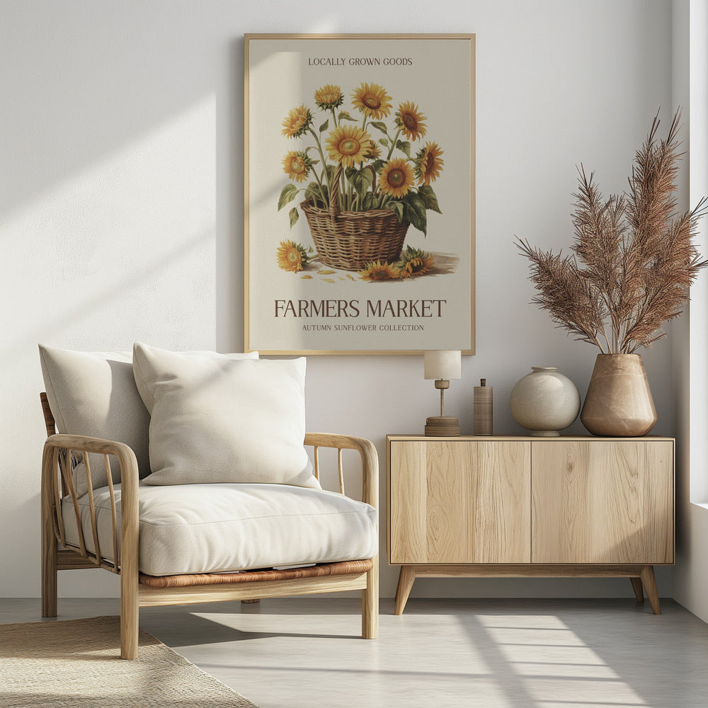 A vintage-style poster with a black frame featuring a botanical illustration of a woven basket filled with yellow sunflowers. Text at the top reads 'LOCALLY GROWN GOODS', and text at the bottom reads 'FARMERS MARKET' and 'AUTUMN SUNFLOWER COLLECTION' on a cream background. Print