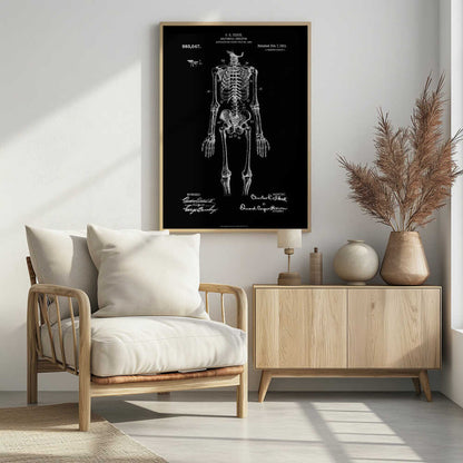 A framed, vintage-style patent illustration of a human anatomical skeleton, presented as a white drawing on a black background. The detailed skeleton is shown from the front, with text indicating the patent number, date, and inventor, C.E. Fleck. Signatures are visible at the bottom. Print