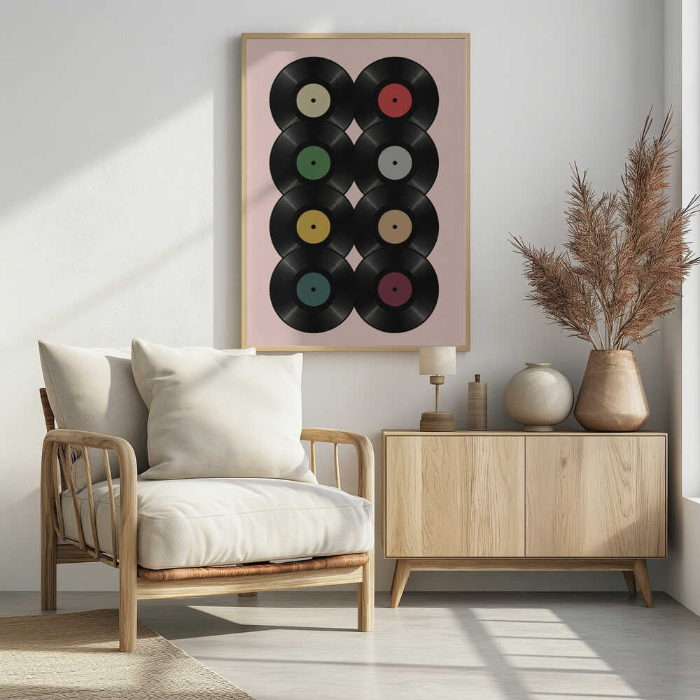 A graphic art print featuring eight black vinyl records arranged in two columns of four against a pale pink background. Each record has a different solid-colored label, creating a colorful and retro pattern. The artwork is enclosed in a simple black frame. Artwork