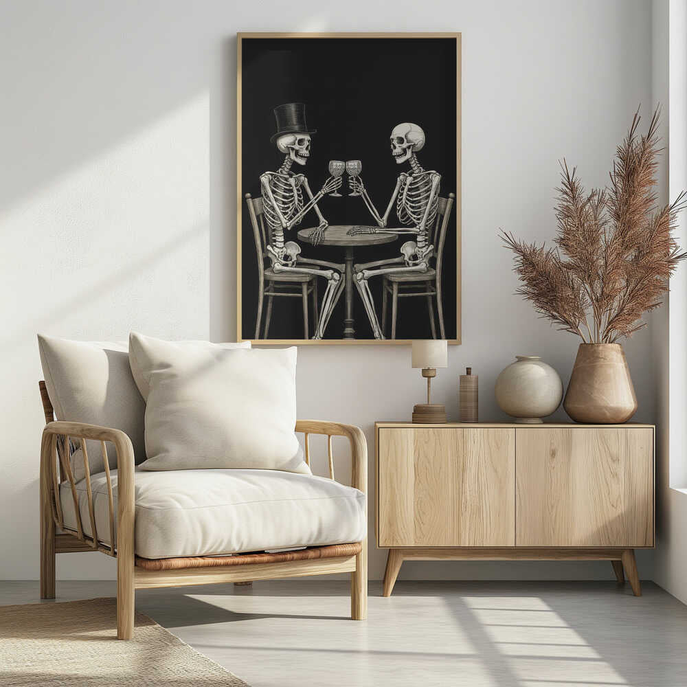 A vintage-style black and white illustration of two skeletons sitting at a round table, toasting each other with wine glasses. One skeleton wears a black top hat, and the background is solid black. Decor