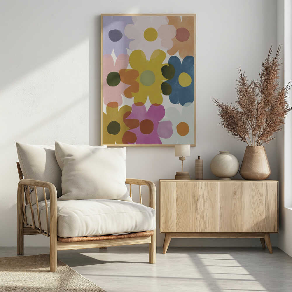 A colorful abstract painting of overlapping, stylized flowers in shades of yellow, blue, pink, orange, and purple. The simple, rounded flower shapes are semi-transparent, creating new colors where they overlap against a light background, all within a thin black frame. Decor