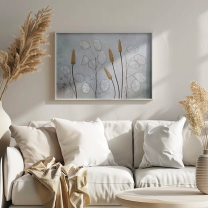 A framed botanical artwork featuring delicate dried stems of silver dollar plants (Lunaria annua) with their translucent white pods, alongside taller brown grasses. The arrangement is set against a muted, pale blue-gray background with faint floral imprints, creating a serene and natural composition. Wall Art