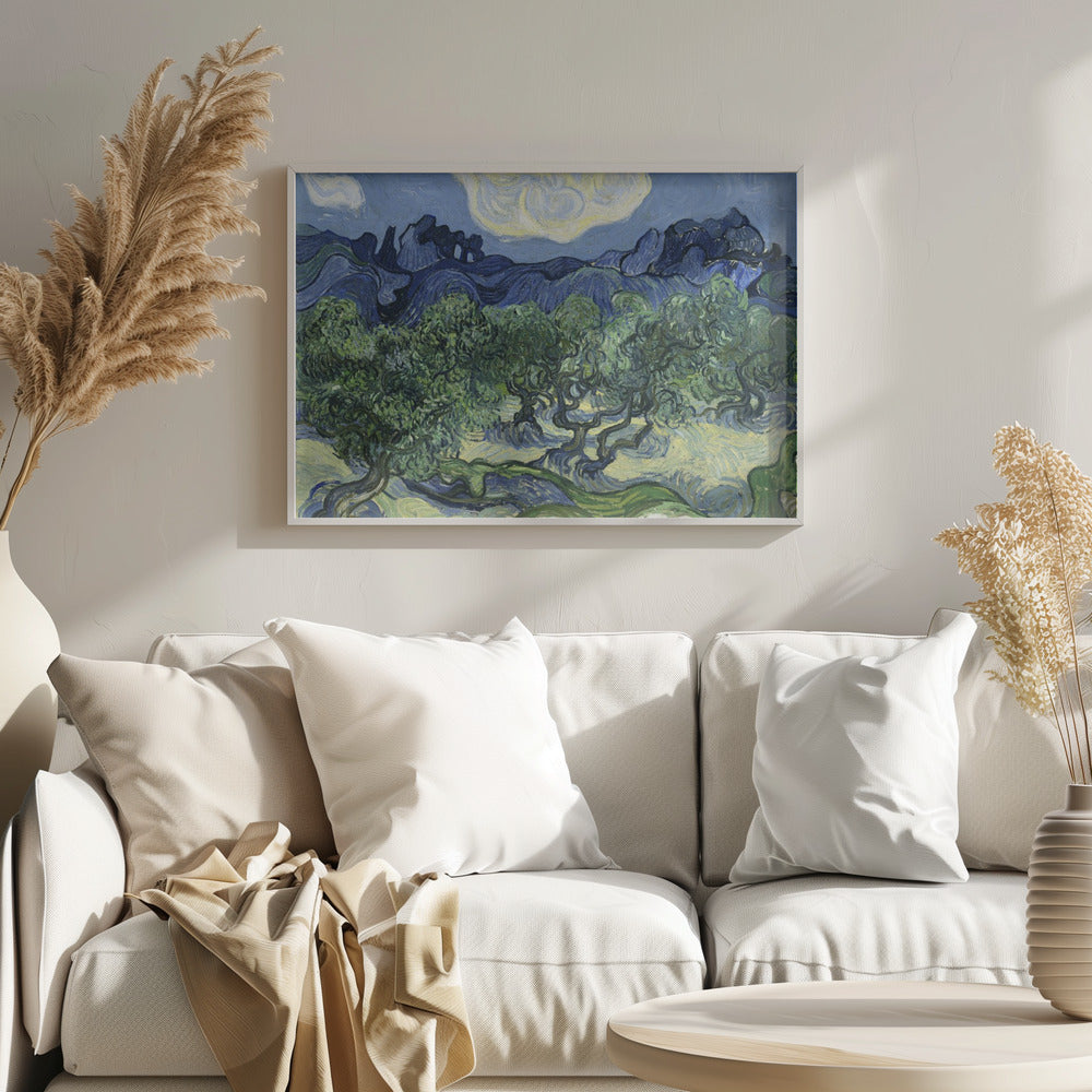 A framed post-impressionist painting by Vincent van Gogh depicting a vibrant landscape of gnarled green olive trees against a backdrop of rolling dark blue mountains under a swirling, stylized sky. Artwork