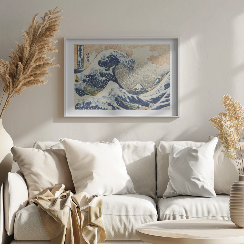 A framed print of Hokusai's 'The Great Wave off Kanagawa,' a Japanese ukiyo-e woodblock print. A huge, dark blue wave with white foam crests over small boats, with a snow-capped Mount Fuji in the distance under a pale orange sky. Artwork