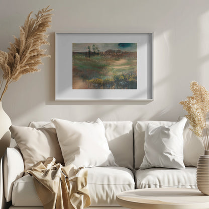 A framed impressionistic painting of a rolling landscape. In the foreground, there are bushes with yellow flowers. The midground features swaths of green and brown grasses, leading to a line of trees and hills in the background under a moody, overcast sky. The artwork is set in a white mat within a silver frame. Artwork