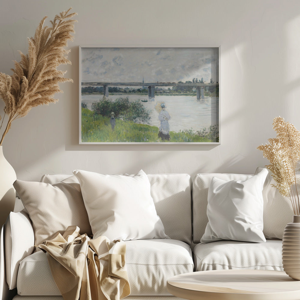 A scenic landscape art print by Claude Monet titled 'The Promenade With the Railroad Bridge, Argenteuil', depicting people on a promenade alongside a body of water with a railroad bridge in the background, characteristic of Impressionist style with soft colors and brushstrokes. Print