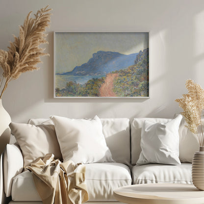 An Impressionist painting by Claude Monet titled 'Cap Martin, near Menton', depicting a sunlit coastal scene. A reddish-brown path winds along a vibrant, brush-covered cliff in the foreground, overlooking the blue Mediterranean Sea. A large, hazy blue mountain dominates the background under a pale yellow sky. Decor