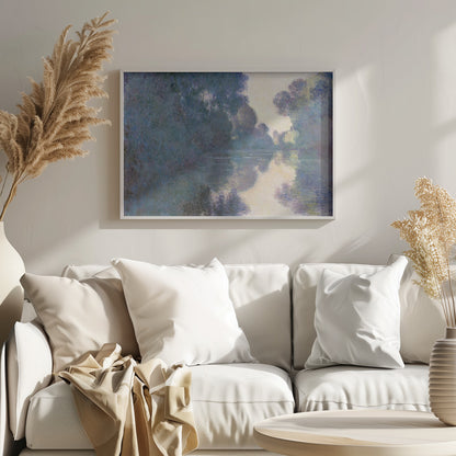 An Impressionist painting in a silver frame depicting a hazy river scene. Lush trees in shades of blue and purple line the banks, their forms and a patch of pale yellow sky softly reflected in the calm water. Artwork