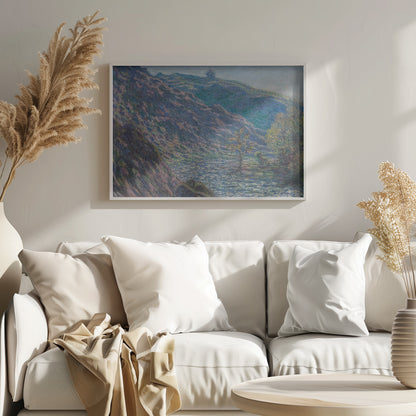 A framed Impressionist painting depicting a river valley. A steep hillside with purple and blue tones dominates the left, while a sun-dappled river flows below. In the distance, gentle green and blue hills rise against a pale sky. Artwork