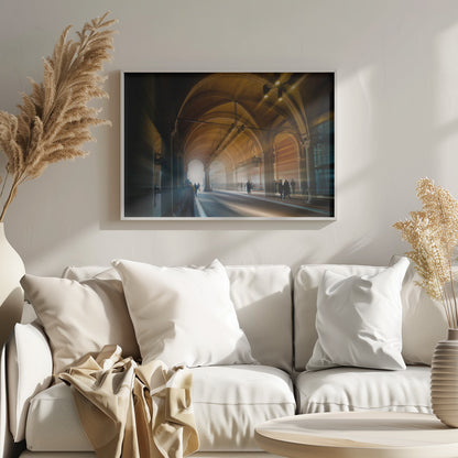 A long exposure photograph of a grand, vaulted hallway with brick arches. Dramatic beams of golden light cut through the space, creating horizontal streaks and a motion blur effect. Silhouettes of people walk through the atmospheric light and shadow. Wall Art