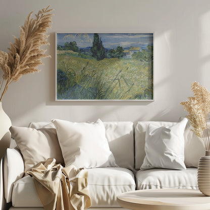 Vincent van Gogh's painting 'Green Wheat Field with Cypress' in a silver frame. The artwork features a vibrant golden-yellow field with green stalks in the foreground, a towering dark green cypress tree at the center, and a small farmhouse in the background under a blue sky with stylized, swirling white clouds. The entire scene is rendered in the artist's characteristic thick, expressive brushstrokes. Print