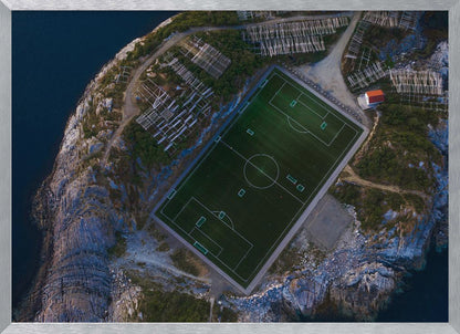 An art print featuring a distant view of a football field under a wide sky, evoking a sense of space and tranquility. Wall Art