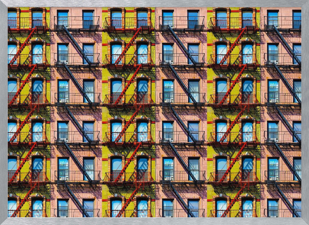 A pop-art style repeating pattern of a colorful apartment building facade featuring pink and yellow walls, windows reflecting a blue sky, and a network of black and red fire escapes, enclosed in a silver frame. Artwork