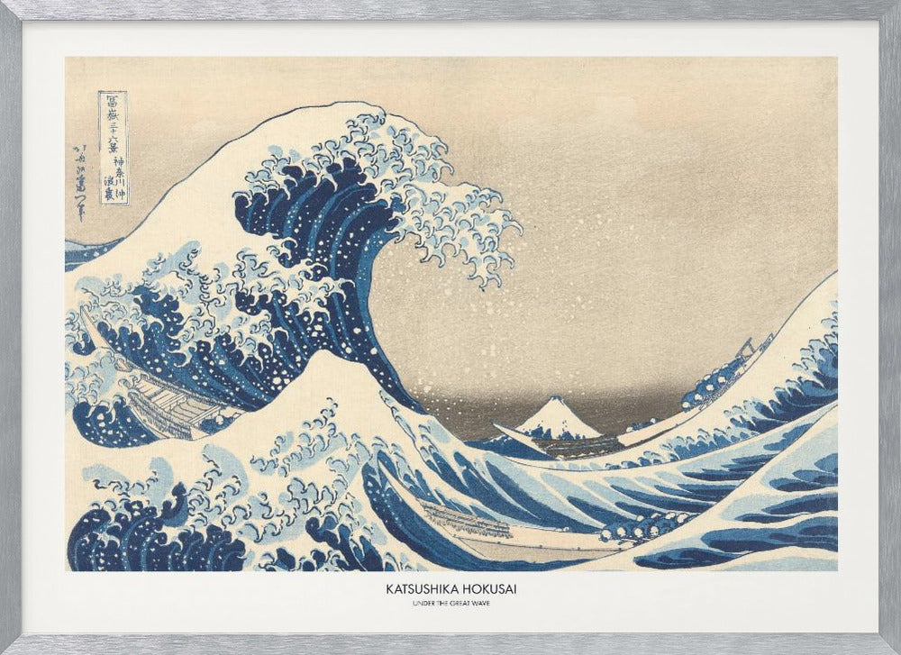 A framed print of Katsushika Hokusai's famous woodblock artwork, 'The Great Wave off Kanagawa,' featuring a giant, turbulent blue wave with white foam cresting over small boats, with Mount Fuji visible in the background under a muted sky. Wall Art