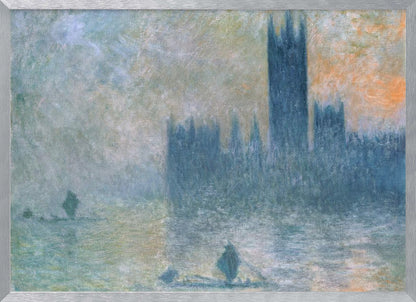 An Impressionist painting in a silver frame depicting the silhouette of the Houses of Parliament in London through a thick blue and grey fog, with the faint orange glow of a sun in the sky and small boats on the River Thames. Wall Art