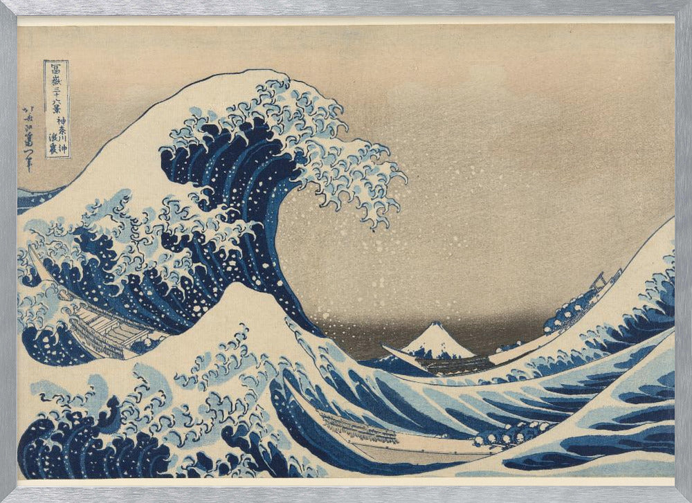 The Great Wave off Kanagawa by Hokusai, a famous Japanese ukiyo-e woodblock print. It depicts a massive, deep blue wave with claw-like white foam cresting and about to crash over three boats, with a small, snow-capped Mount Fuji visible in the background under a pale, graded sky. Artwork
