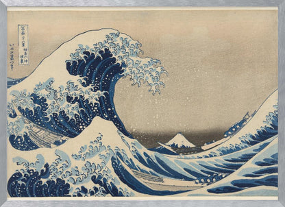 The Great Wave off Kanagawa by Hokusai, a famous Japanese ukiyo-e woodblock print. It depicts a massive, deep blue wave with claw-like white foam cresting and about to crash over three boats, with a small, snow-capped Mount Fuji visible in the background under a pale, graded sky. Artwork
