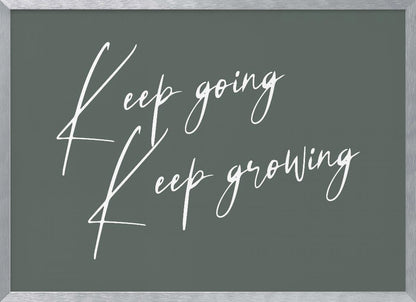 A motivational art piece featuring the words 'Keep going' and 'Keep growing' in a delicate white script on a muted sage green background, set within a simple silver frame. Print