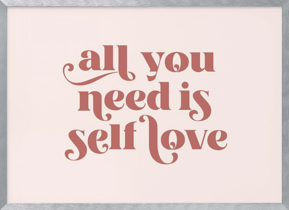 A framed art print with the phrase 'all you need is self love' in a stylish, dusty rose serif font on a light pink background. The artwork is enclosed in a simple silver frame. Poster