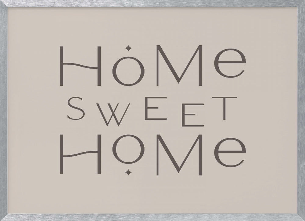 A minimalist wall art piece with the words 'Home Sweet Home' in a dark gray, stylized sans-serif font against a light beige background, all housed within a simple silver frame. Decor