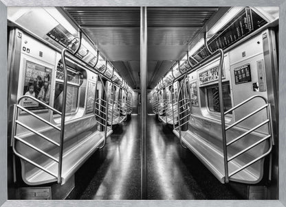 A framed, black and white photograph capturing a perfectly symmetrical view down the aisle of an empty subway car. The reflective, dark floor and the metallic seats and handrails create strong leading lines, giving the image a sense of depth and urban solitude. Wall Art