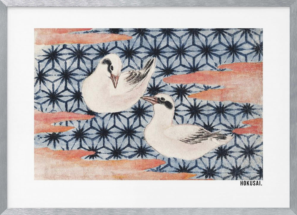 A classic Japanese woodblock print by Hokusai featuring two white birds with black eye markings resting on a background of a traditional blue Asanoha geometric pattern. Soft, reddish-orange cloud-like shapes float across the scene. Print