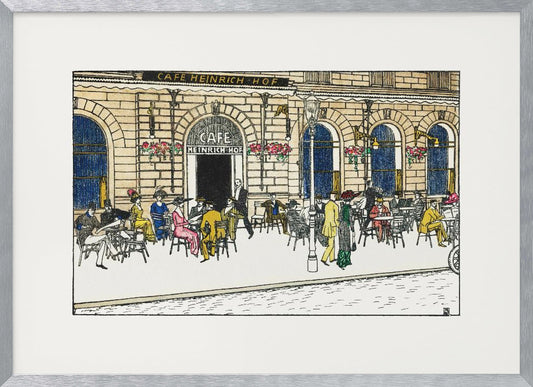 A vintage-style color illustration of the exterior of 'Cafe Heinrich Hof'. Patrons dressed in early 20th-century attire are seated at tables on the sidewalk patio, socializing under the building's arched windows. The artwork is shown within a silver frame. Decor