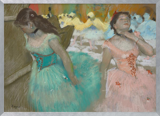 A framed pastel artwork by Edgar Degas depicting several ballerinas. In the foreground, a ballerina in a turquoise tutu looks down, while another in a pink tutu adjusts her collar with her eyes closed. In the background, more dancers in yellow and white are blurred on a stage. Wall Art