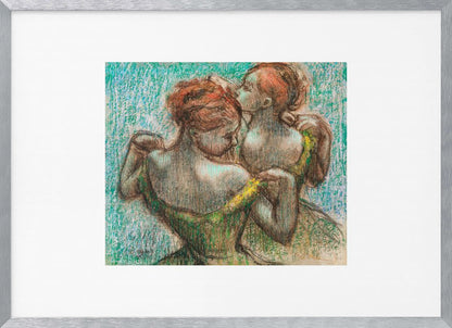 A framed pastel drawing by Edgar Degas, 'Two Dancers', depicting two ballerinas from behind. One dancer in a green dress with a yellow strap adjusts her costume, while another stands closely behind her against a textured turquoise background. The style is Impressionistic, capturing a candid moment. Artwork