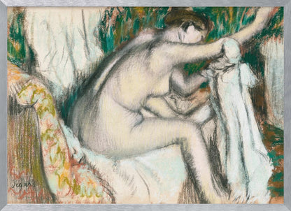 A framed pastel drawing by Edgar Degas depicting a nude woman from the back, seated on a patterned chair. Her body is rendered in soft yellow and grey tones, while she interacts with white drapery against a background of energetic green and brown strokes. Print