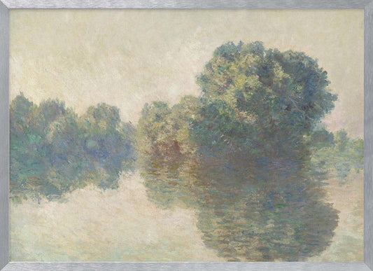 An impressionist painting of lush green trees on a riverbank, their forms blurred and reflected in the calm, hazy water below. The scene is rendered in soft, muted tones, creating a serene and atmospheric quality, and is presented in a simple silver frame. Artwork