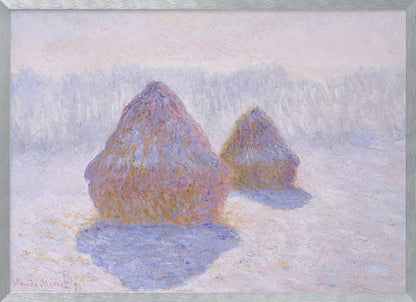 An impressionist painting by Claude Monet titled 'Haystacks,' showing two large, conical haystacks in a snowy field. The scene is bathed in a soft, hazy light, with pinks and oranges on the sunlit side of the haystacks and long, purple shadows cast across the lavender and white snow. The artwork is presented in a simple silver frame. Wall Art