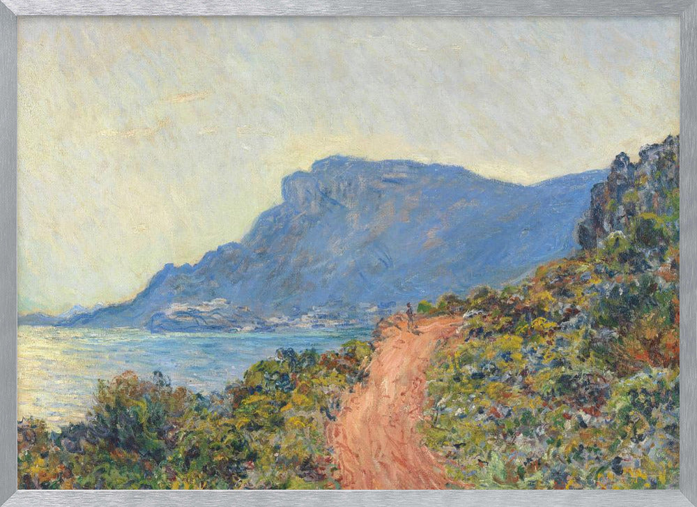 An Impressionist painting by Claude Monet titled 'Cap Martin, near Menton', depicting a sunlit coastal scene. A reddish-brown path winds along a vibrant, brush-covered cliff in the foreground, overlooking the blue Mediterranean Sea. A large, hazy blue mountain dominates the background under a pale yellow sky. Decor