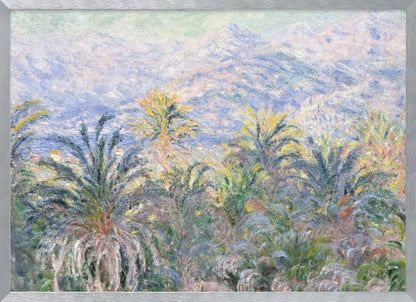 Impressionist painting 'View of Bordighera' by Claude Monet, featuring a lush foreground of green and yellow palm trees overlooking a hazy, sun-drenched coastal town and distant blue mountains, all rendered with soft, dappled brushstrokes and set within a silver frame. Artwork