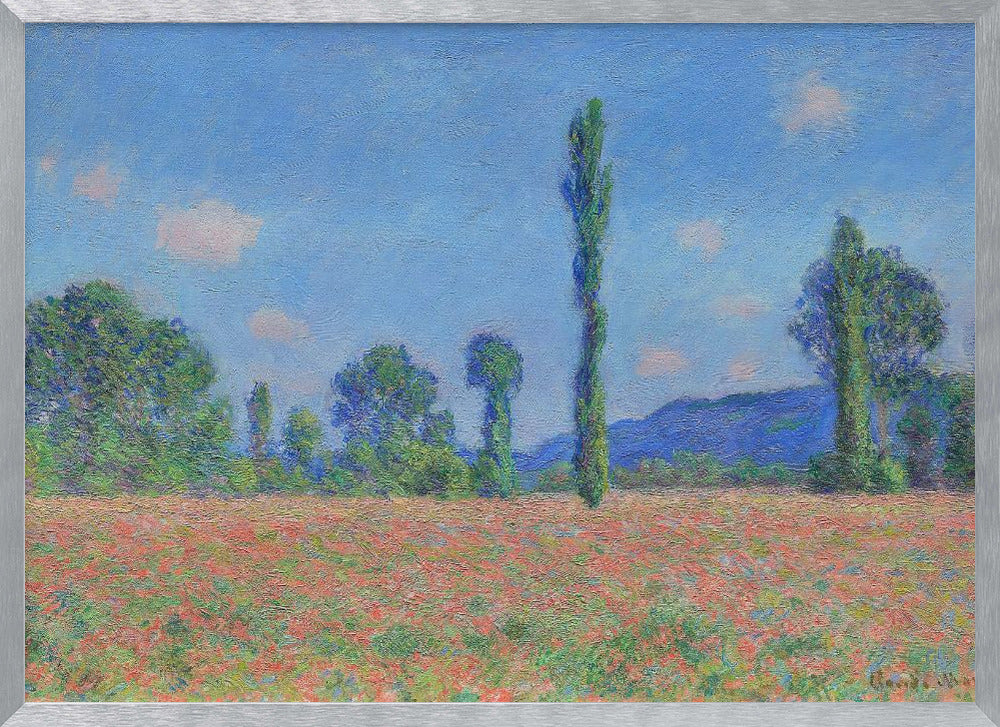 An impressionist painting of a vibrant landscape, 'Poppy Field' by Claude Monet, in a silver frame. It depicts a field of red flowers in the foreground, with a line of green trees and tall poplars against a backdrop of distant blue hills and a bright blue sky with soft clouds. Print