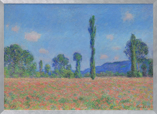 An impressionist painting of a vibrant landscape, 'Poppy Field' by Claude Monet, in a silver frame. It depicts a field of red flowers in the foreground, with a line of green trees and tall poplars against a backdrop of distant blue hills and a bright blue sky with soft clouds. Print