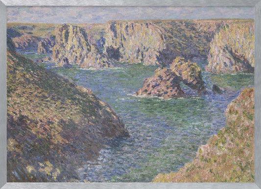An impressionist painting by Claude Monet of a rugged coastline. Steep, sun-drenched cliffs surround a bay of choppy blue-green water. In the center, a large rock formation features a natural arch. The entire scene is rendered with visible, textured brushstrokes and is enclosed in a silver frame. Artwork