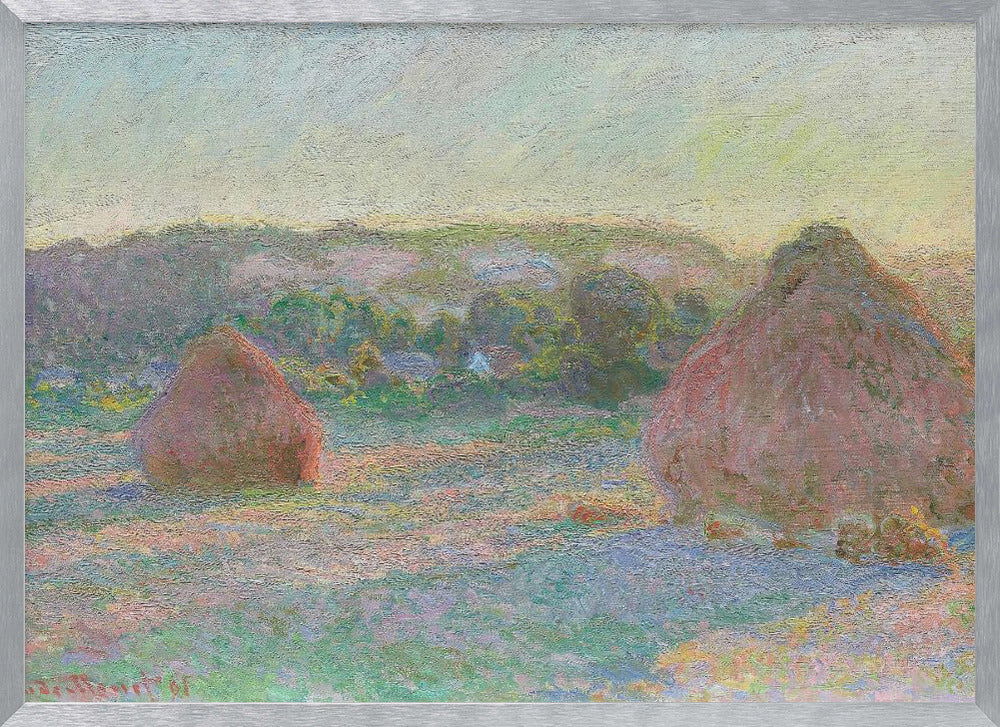 An Impressionist painting by Claude Monet depicting two large, reddish haystacks in a field of green and purple hues during sunrise, with a line of distant trees under a pale yellow sky, all within a silver frame. Poster